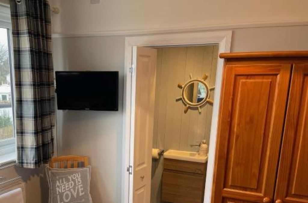 Room corner showing en-suite bathroom door